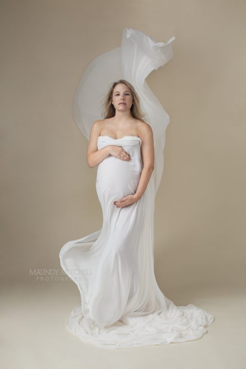 Maternity portrait of Sarah in flowy white silk