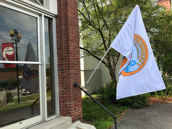 Maundy Mitchell Photography studio downstairs door and Walkabout Wednesday flag