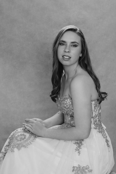 Black and white portrait of Kenzie in prom gown