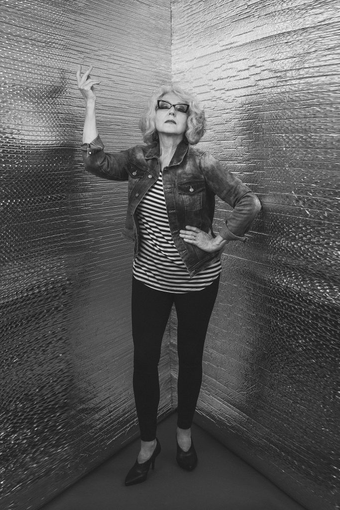 Modern "Corner Portrait" of Hanna in stripes with hand gesture