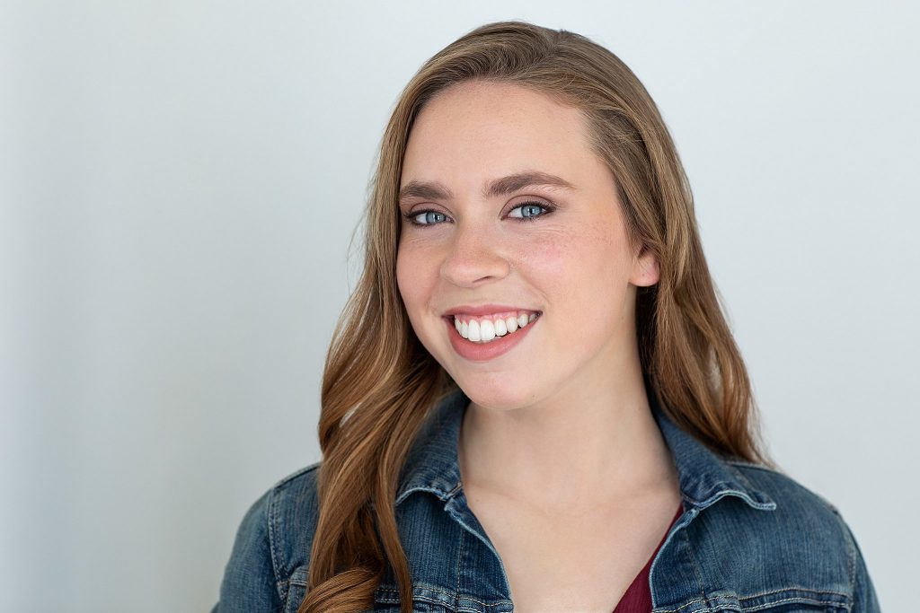 Acting headshot with light background for high school senior, Kenzie