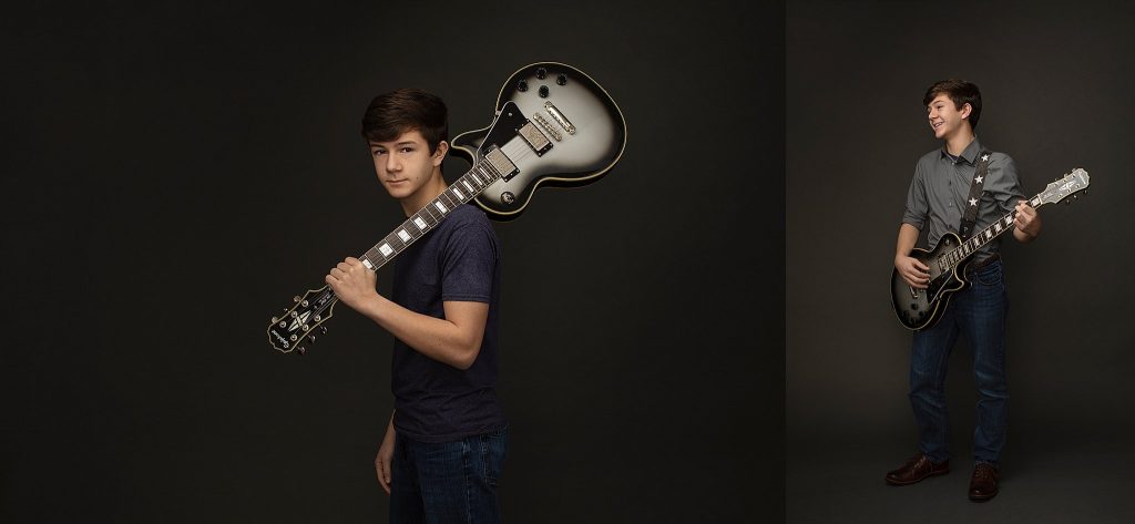 portrait of teenage boy with electric guitar