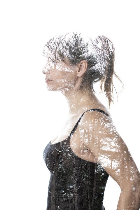 An in-camera double-exposure portrait of Susan and the forest.