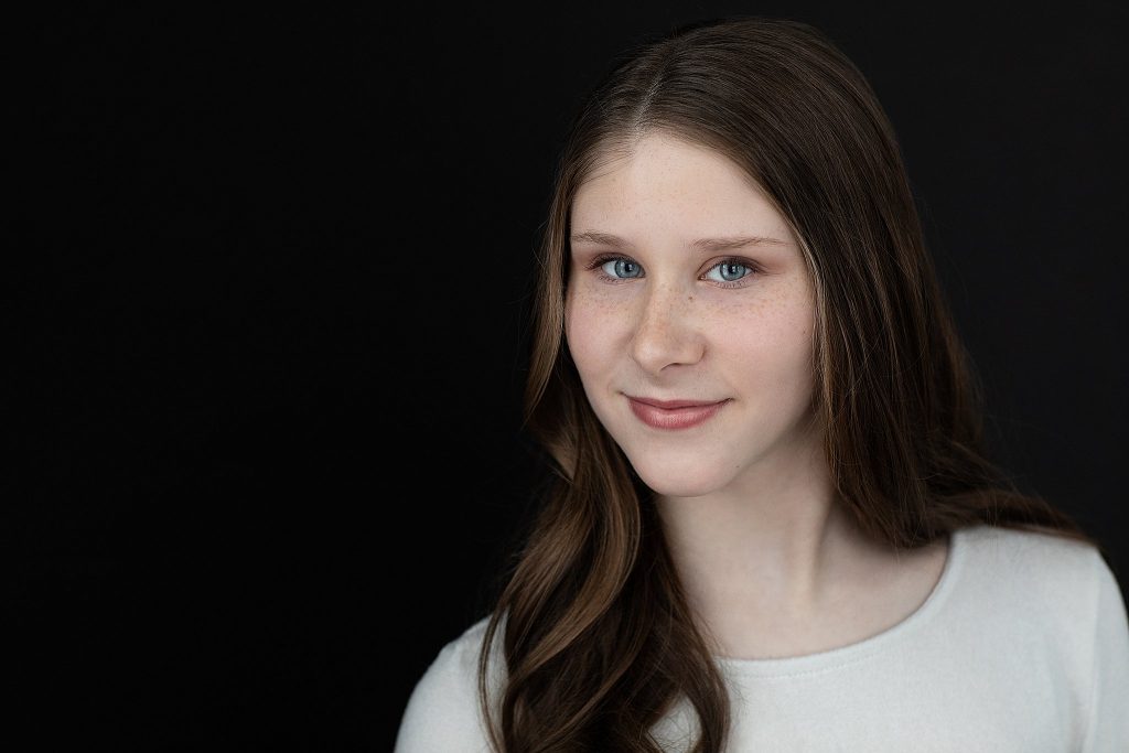 Sophie Pankhurst - headshot in white shirt on black background