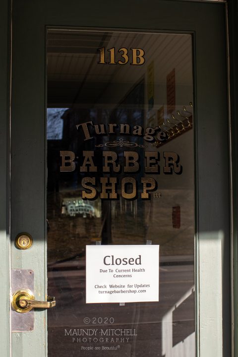Sign on barber shop door