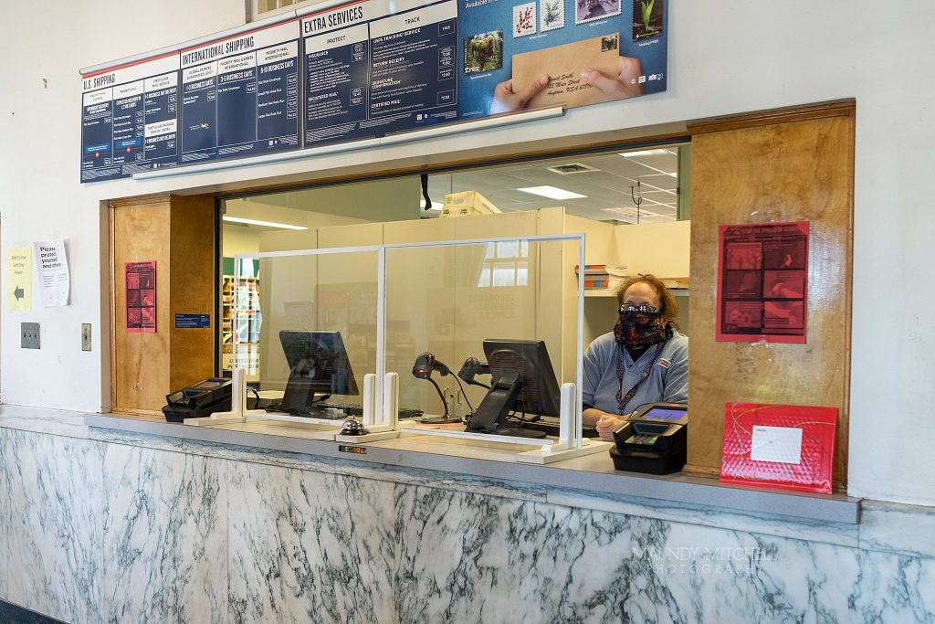 The new setup at Plymouth Post office - glass windows separate workers from customers.