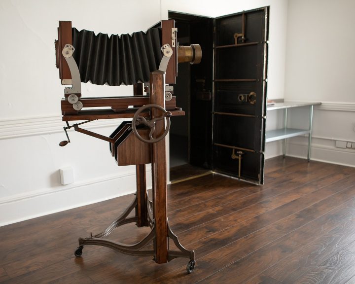 Deardorff camera at Maundy Mitchell Photography's new tintype studio room, with bank vault darkroom in the background.