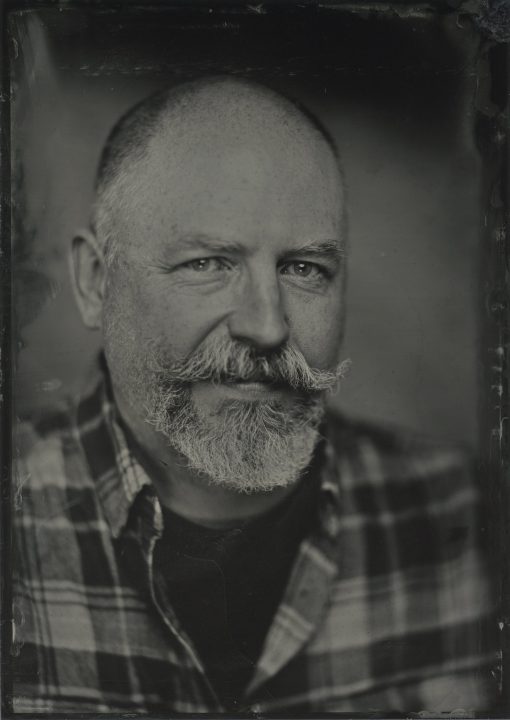 wet plate collodion (tintype / ferrotype) portrait of a man with a mustache