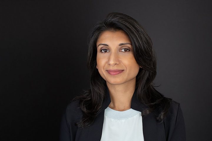 Business headshot with black background - Shwetha wearing shirt and jacket