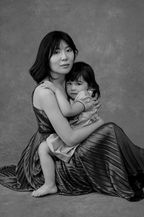 Black and white portrait of a mother and young daughter