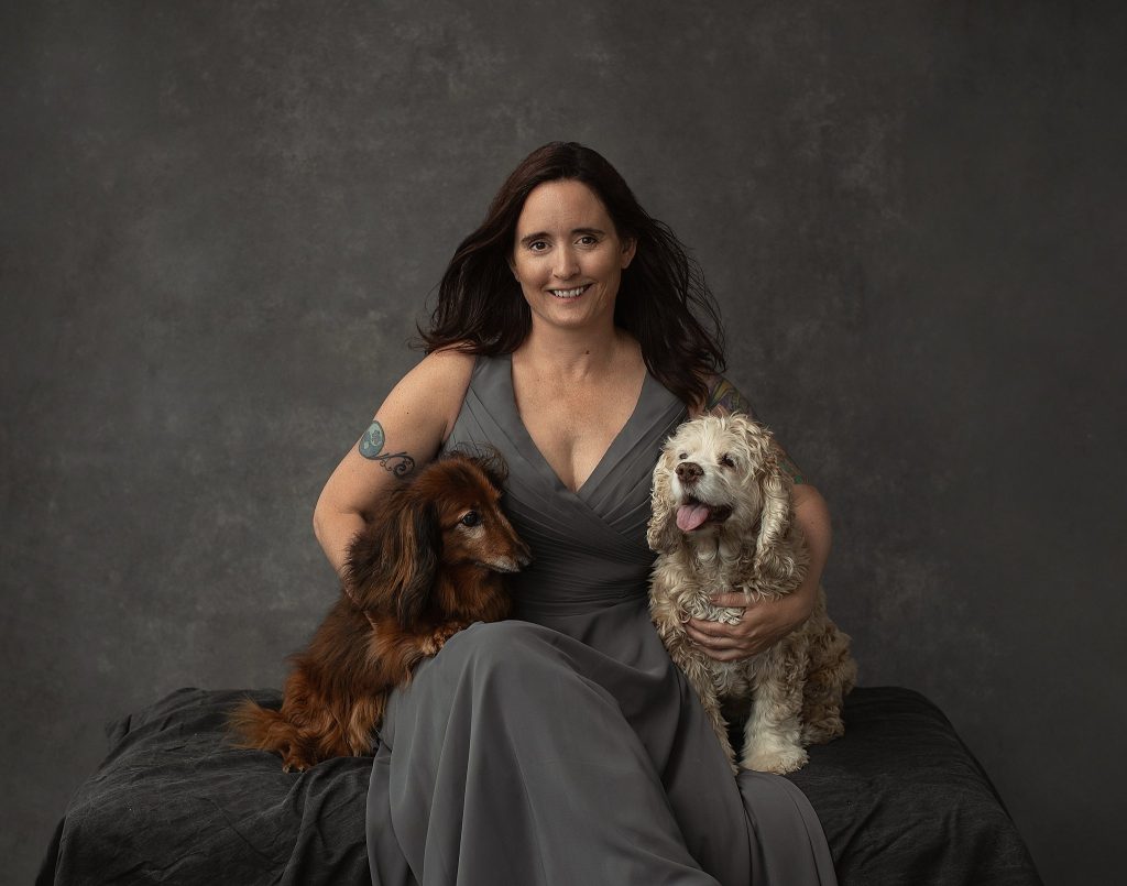 Portrait of Danielle with her elderly dogs