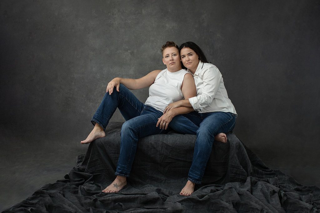 Casual tenth anniversary studio portraits for a same sex couple - jeans and white shirts