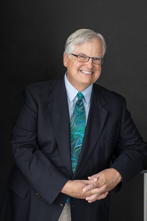 Business headshot for professor composer Jonathan Santore -wearing suit coat and tie