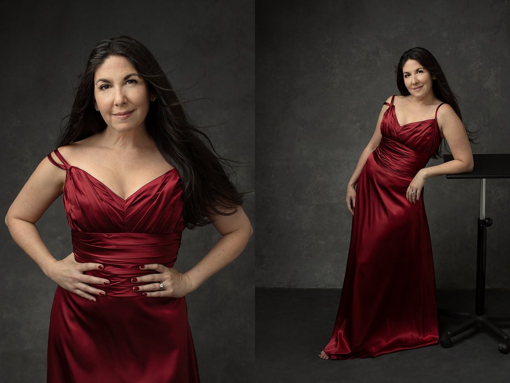 Studio photos of a woman with long hair wearing a long red silk dress