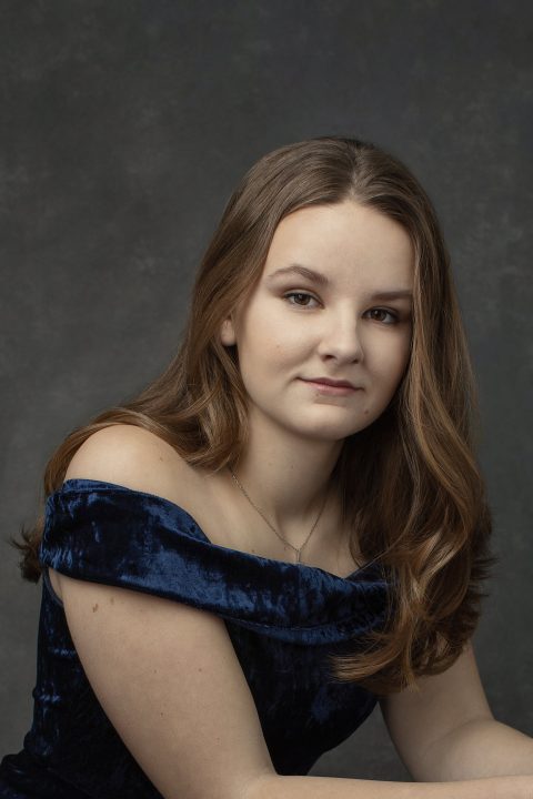 Portrait of Laurel in a blue velvet dress