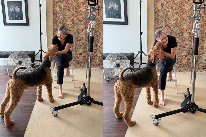 Behind the scenes - portrait photographer Maundy Mitchell with a client's dog, in between sets