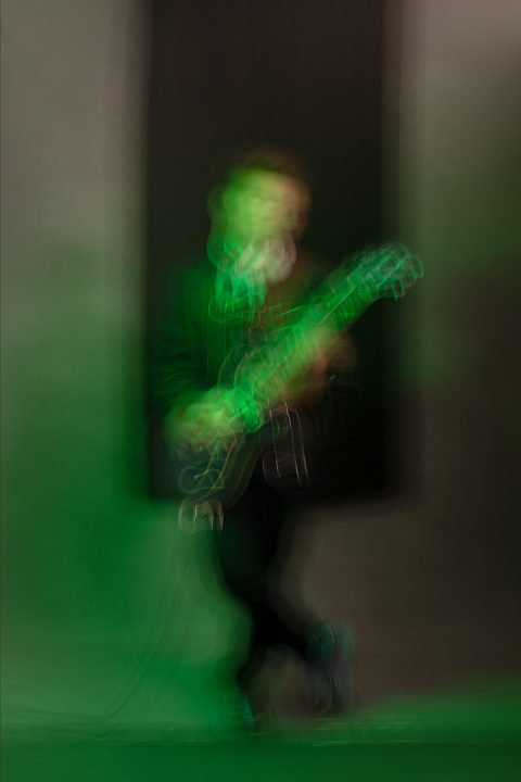 An abstract portrait made with green light, a slow shutter speed, and intentional movement