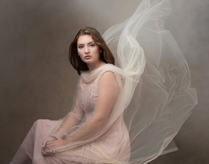 Senior photo of Lindsay with sheer flowing fabric