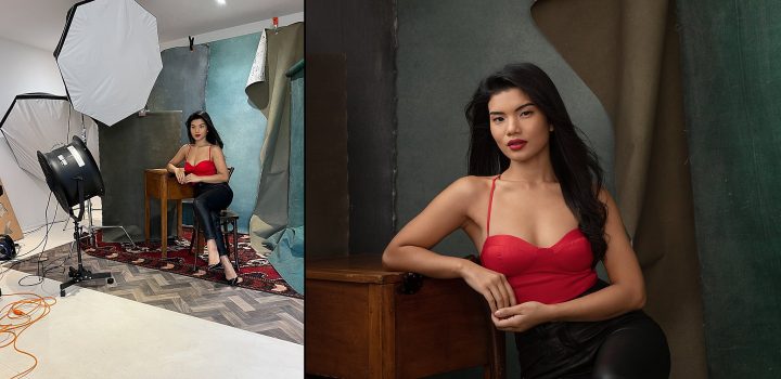 Behind the scenes at David Shoukry's studio, English Photoworks / Finished portrait of Astrid, seated and leaning on a desk, wearing a red top 