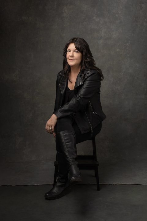 Portrait of Kree wearing a black leather jacket and boots