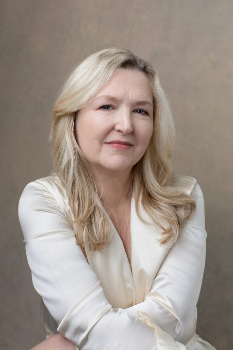 Portrait of MaryEllen wearing cream silk blouse during her Over 50 Revolution photo session