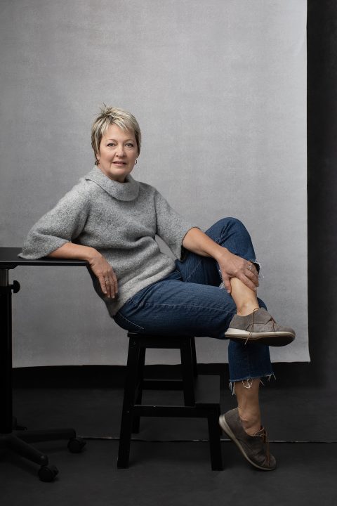 Casual portrait of Carol, wearing jeans and a sweater, for Unforgettable: the Over 50 Revolution
