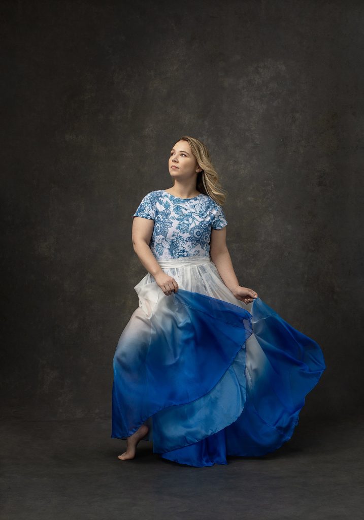 Portrait of dancer Suzanna wearing blue and white
