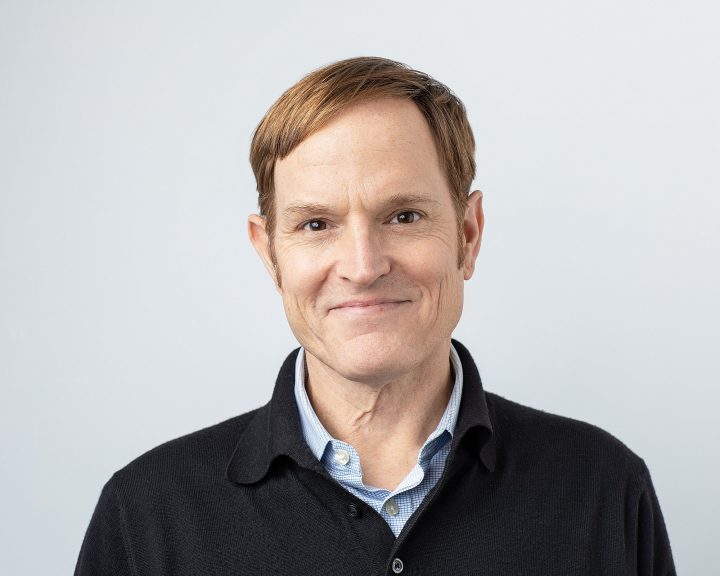 Casual headshot of PSU Provost Nate Bowditch with black background