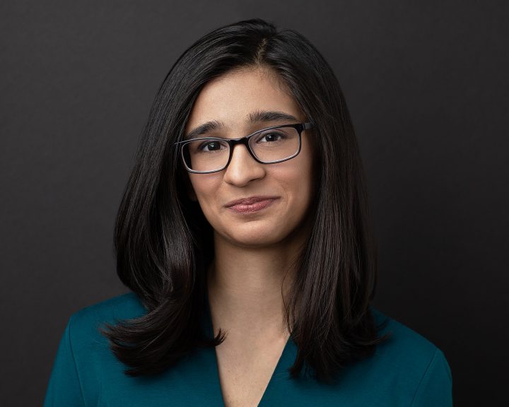 Riyah Patel headshot in front of black background