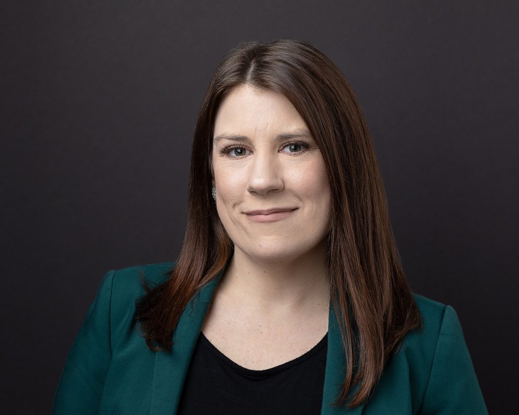 Business headshot with black background