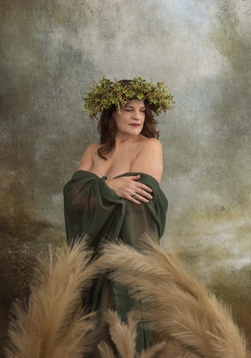 Portrait of Heidi wrapped in fabric and wearing a crown of vines for Extraordinary: the Over 50 Revolution