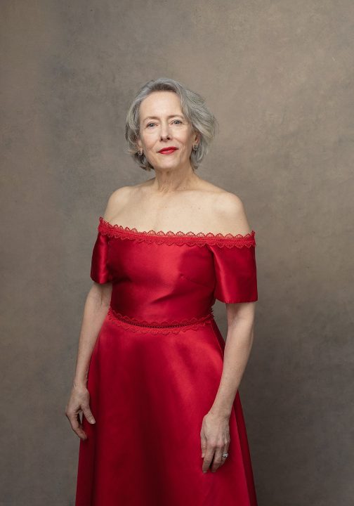 Portrait of Jean, wearing a red gown by Monique Lhuillier