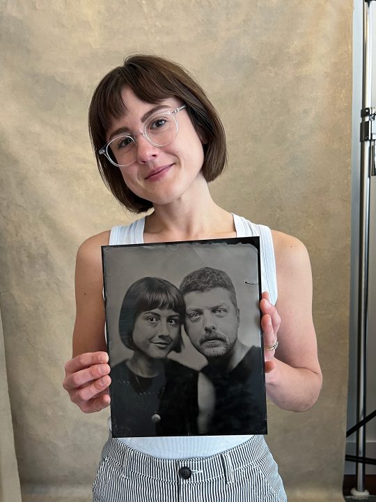 Rebecca, holding the couple's 8x10 tintype anniversary portrait