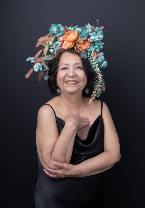 Maria, wearing a Mexican-inspired floral crown for her portrait session for Extraordinary: the Over 50 Revolution