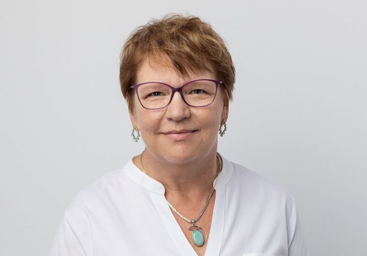 A headshot of Karen with a white background