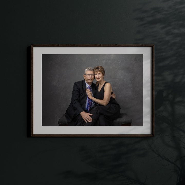 A framed wall portrait of a close couple