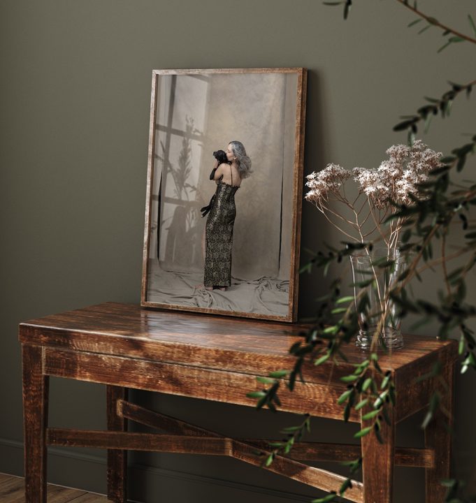 Framed portrait of a woman with her dog