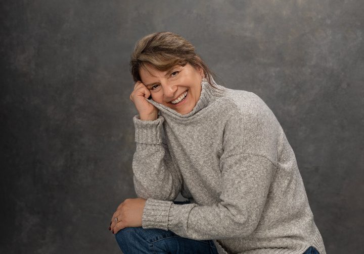 Casual portrait of Beth wearing a sweater, smiling for Extraordinary: the Over 50 Revolution