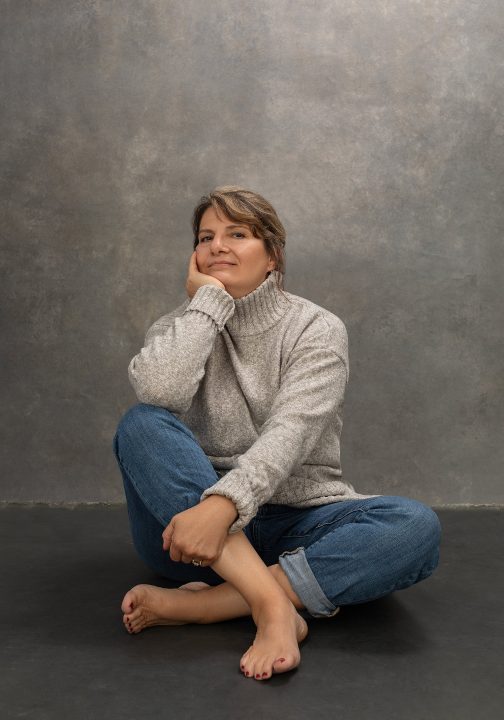 Casual portrait of Beth for her photo session for Extraordinary: the Over 50 Revolution. She is wearing a casual turtleneck sweater