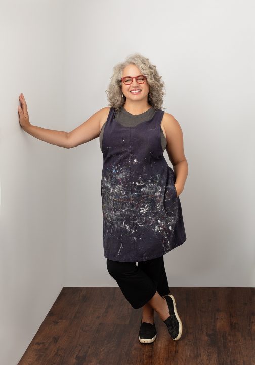 Portrait of Cheryl wearing artist's smock as part of her Portrait Experience for Extraordinary: the Over 50 Revolution at Maundy Mitchell Photography