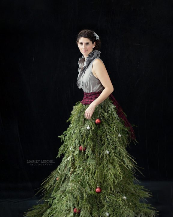 Portrait of Erica wearing a Christmas tree skirt
