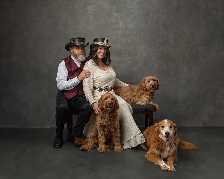 Portrait of Christine and Mark with their dog family