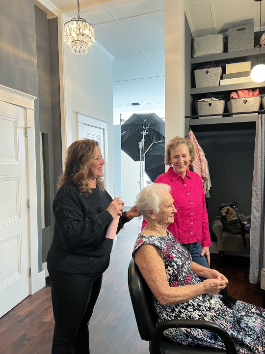 Behind the scenes - Mother & Daughter enjoying professional hair and makeup styling as part of their photo session for The Over 50 Revolution