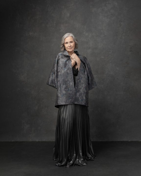 Portrait of Georgia wearing a silver gown for The Over 50 Revolution portrait experience