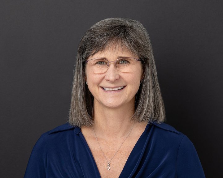 A headshot for Melinda Johnston, Central New Hampshire Physical Therapist, against a black background