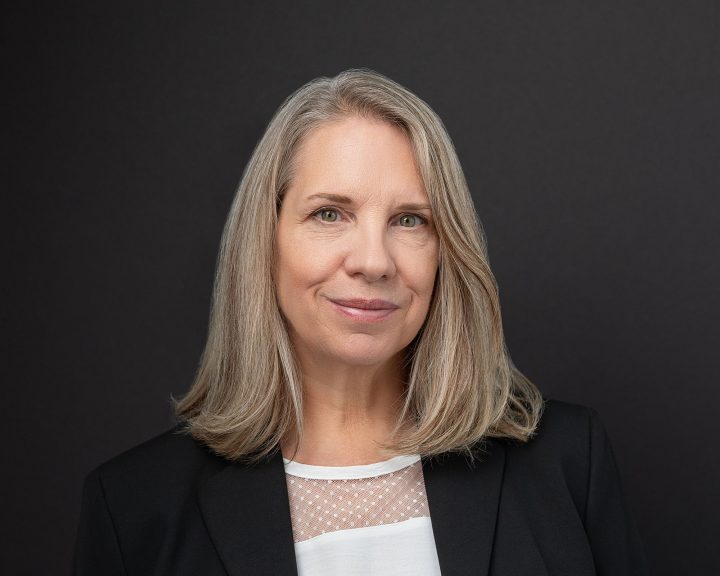 A headshot with a black background for a New Hampshire paralegal