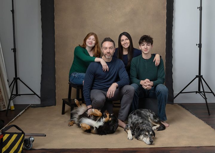 A "dirty frame" family portrait with dogs