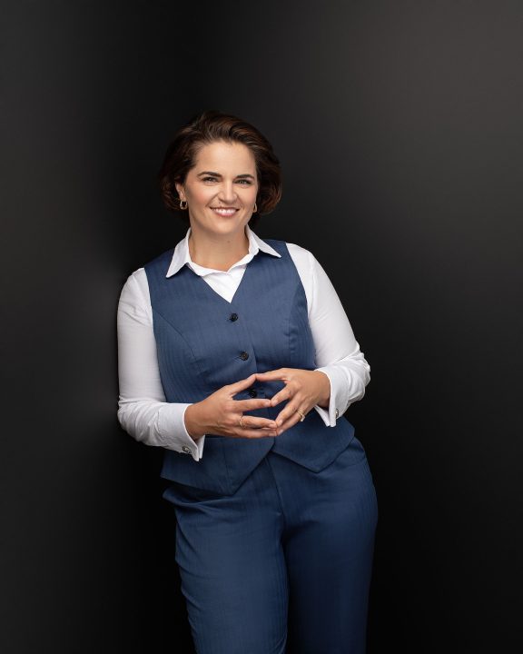 Business portrait of Rita standing