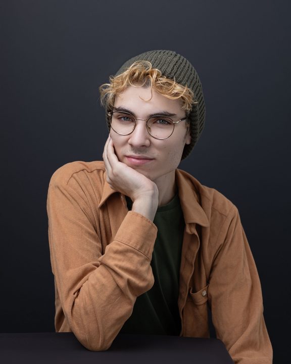 a portrait of stage manager Nikita Chernin with a black background