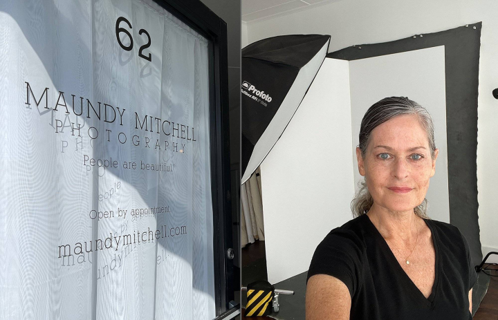 Maundy Mitchell standing in the open door of her photo studio on Main St. in Plymouth, NH